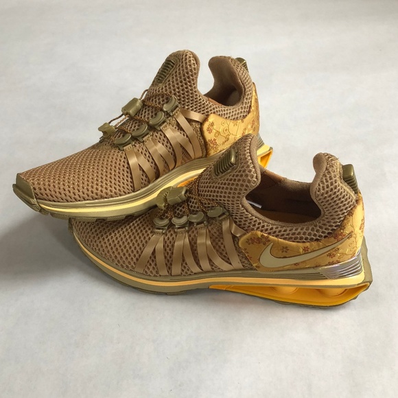 nike shox gravity metallic gold women's shoe